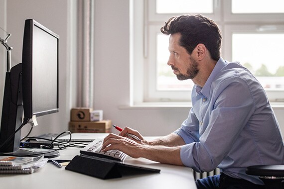 man working on computer using remote desktop